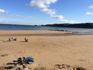 View of a quiet Saundersfoot beach on a hot bank holiday weekend